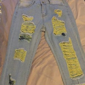 Light blue jeans with yellow and blue disresed
